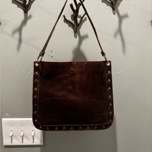 Brown leather button hand bag